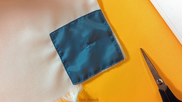 reinforced tzitzit hole