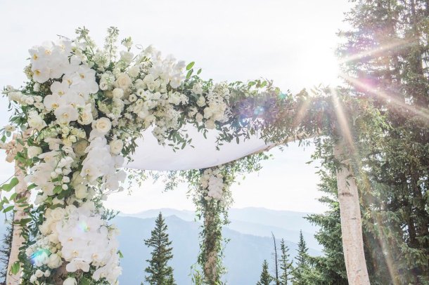 Silk chuppah canopy with white flowers
