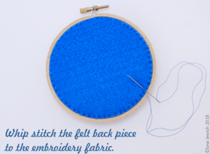 whip stitch felt back piece to embroidery fabric